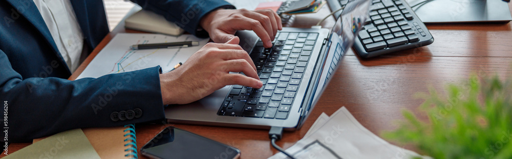Close up of businessman hands working on laptop in home office. High quality photo Close up of businessman hands working on laptop in home office. High quality photo