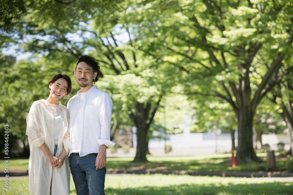 Image of happy couple or married couple Bearded man and beautiful woman Wide angle Looking at camera Image of happy couple or married couple Bearded man and beautiful woman Wide angle Looking at camera