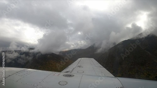 Footage out of plane wing over Alaska, USA photo