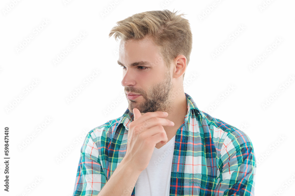 pondering millennial guy on background. millennial guy in studio. photo of millennial guy pondering millennial guy on background. millennial guy in studio. photo of millennial guy