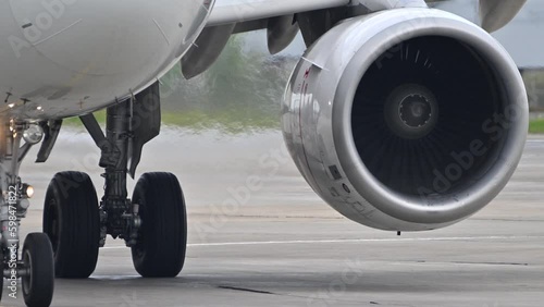 Huge airplane jet engine close up view moving forward heat haze distant airplane lining up behind. 4k super slow motion raw video 120 fps Generative AI photo