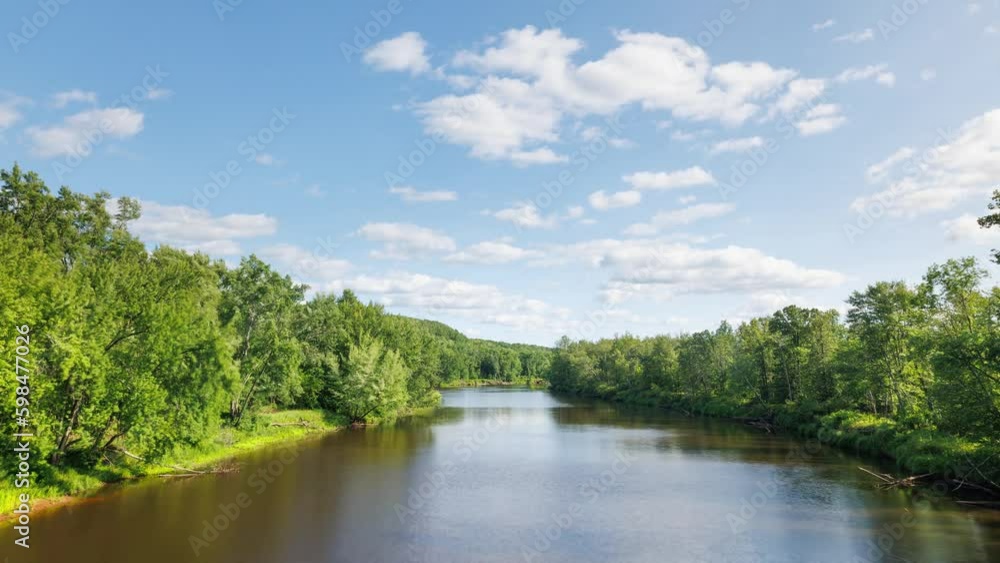 Time lapse of the clouds moving above Kettle River surrounded by forest in Minnesota. Time lapse of the clouds moving above Kettle River surrounded by forest in Minnesota.