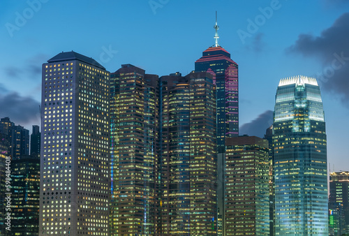 High rise modern office building and skyline of Hong Kong city at dusk