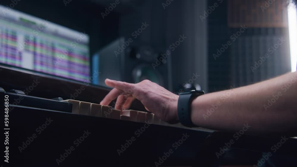 Audio engineer, producer uses MIDI controller, digital electric piano for creating music. Screen showing DAW software interface with sound tracks. Sound recording studio. Music Generative AI