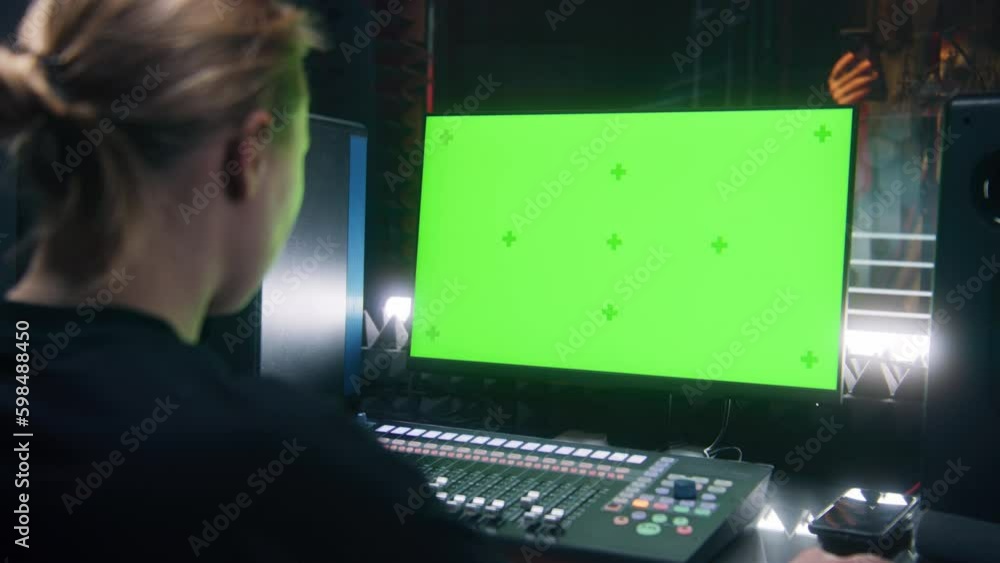 Pruducer Screen Female audio engineer, producer uses mixing board. Green screen on PC ...