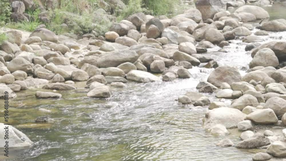 flowing water stream creek river rock stone. Tranquil summer nature view flowing water stream creek river rock stone. Tranquil summer nature view