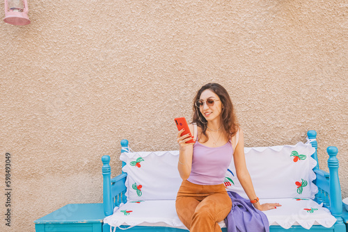 Tourist girl in authentic cafe in Al Fahidi district in Dubai photo