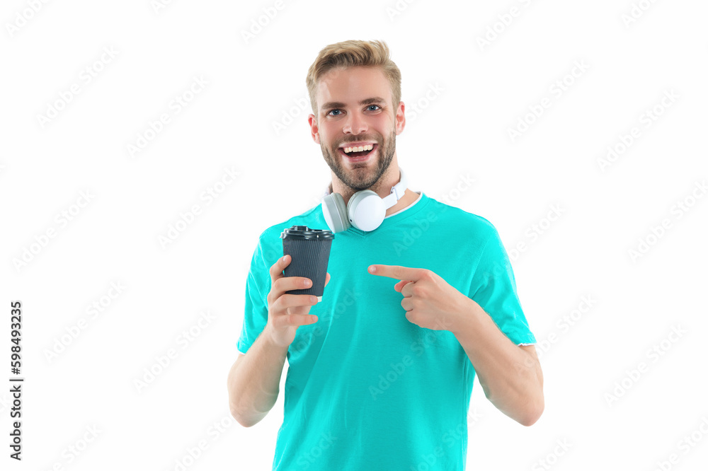 millennial guy with coffee in studio, pointing finger. photo of millennial guy with coffee. millennial guy with coffee in studio, pointing finger. photo of millennial guy with coffee.