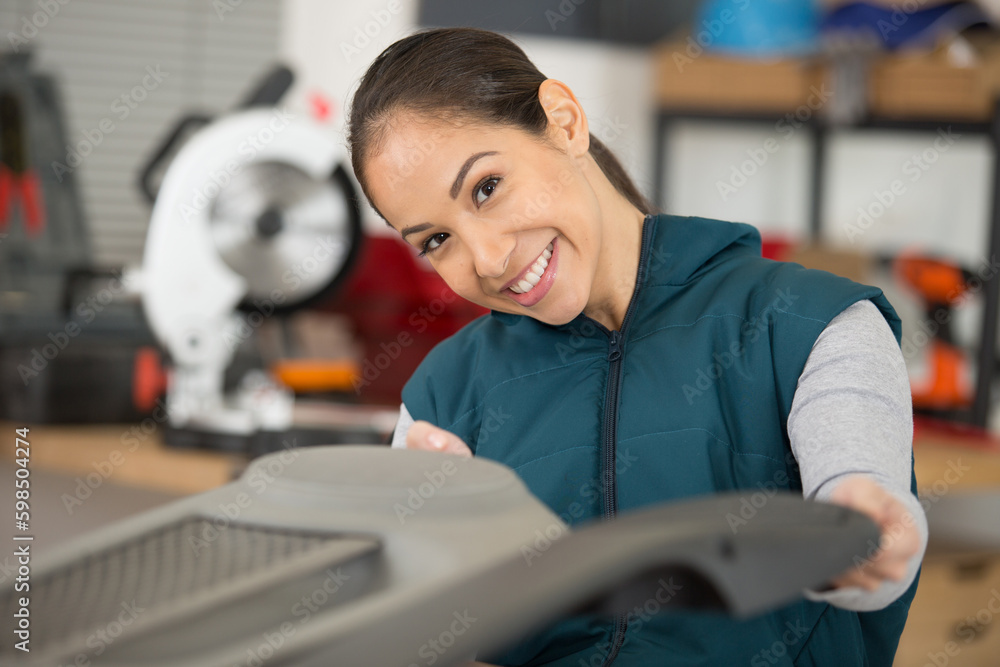 mechanic repairing parts of a car in a garage mechanic repairing parts of a car in a garage