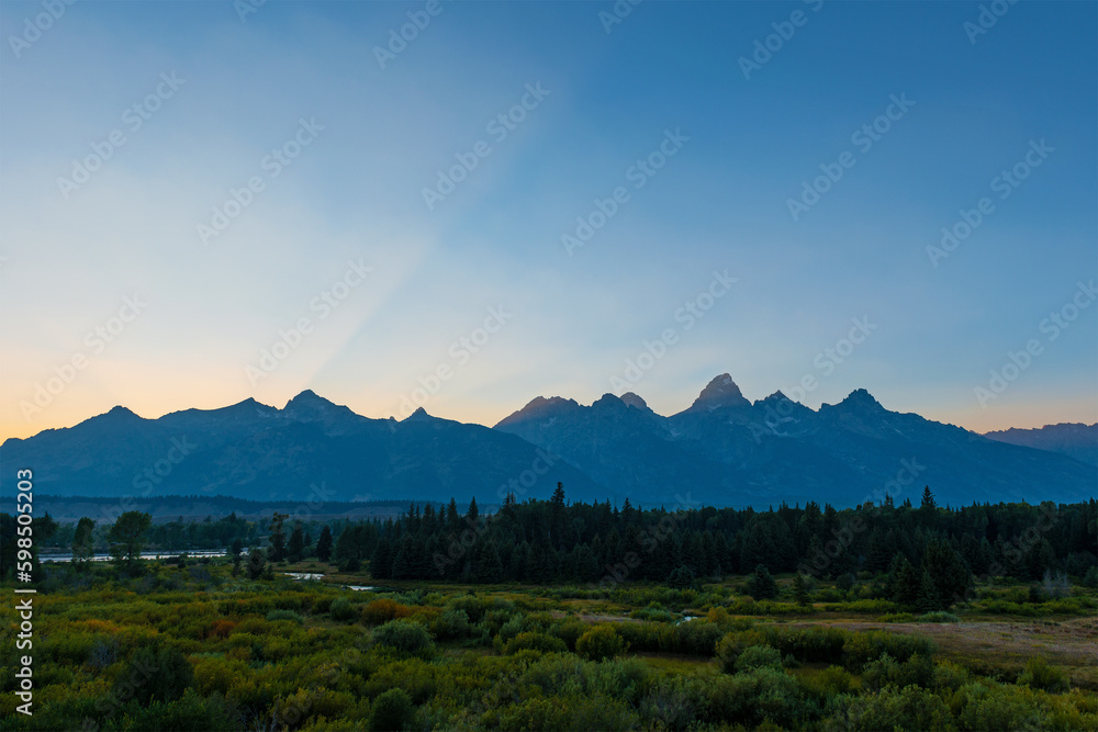 Grand Teton mountain peaks with sunset sunbeam, Grand Teton national park, Wyoming, USA.