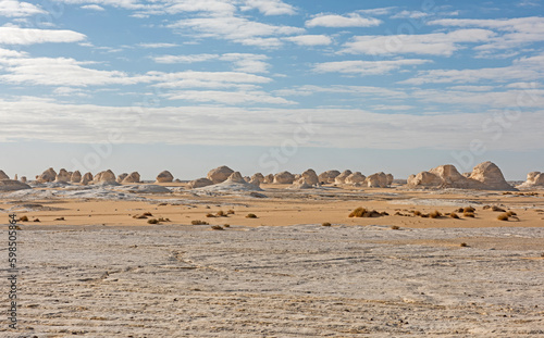 Barren desert landscape in hot climate with rock formations