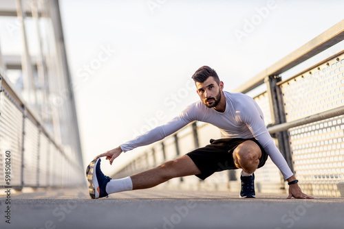 Athletic man stretch and exercise on the  brigde