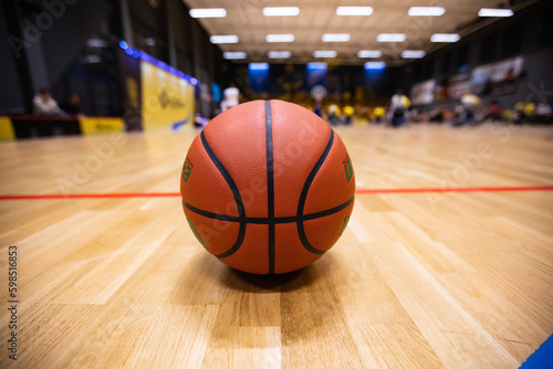 Closeup of basketball ball on the court during wheelchair © Ruslan