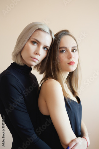View of two young women on a light background.