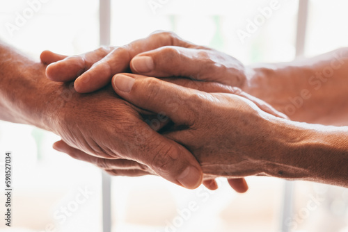 Old people holding hands close up view, senior retired family couple express care as psychological support concept, trust in happy marriage, empathy hope