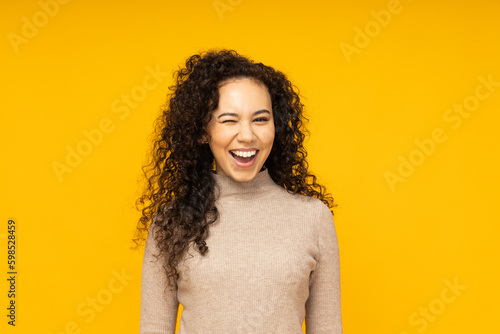 Young woman in casual wearing on yellow background