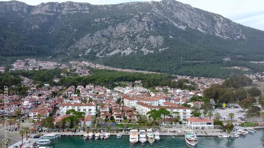 Drone shot of popular town of Akyaka, with its scenic coastline, and stunning natural surroundings, Akyaka is a popular destination for tourists Drone shot of popular town of Akyaka, with its scenic coastline, and stunning natural surroundings, Akyaka is a popular destination for tourists