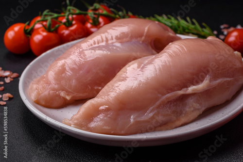 Pieces of raw chicken or turkey fillet with salt, spices and herbs