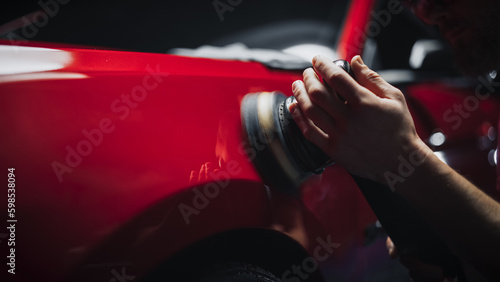 Obraz na plátne Car Ad Style Photo of a Professional Car Detailer Using an Electric-Powered Poli