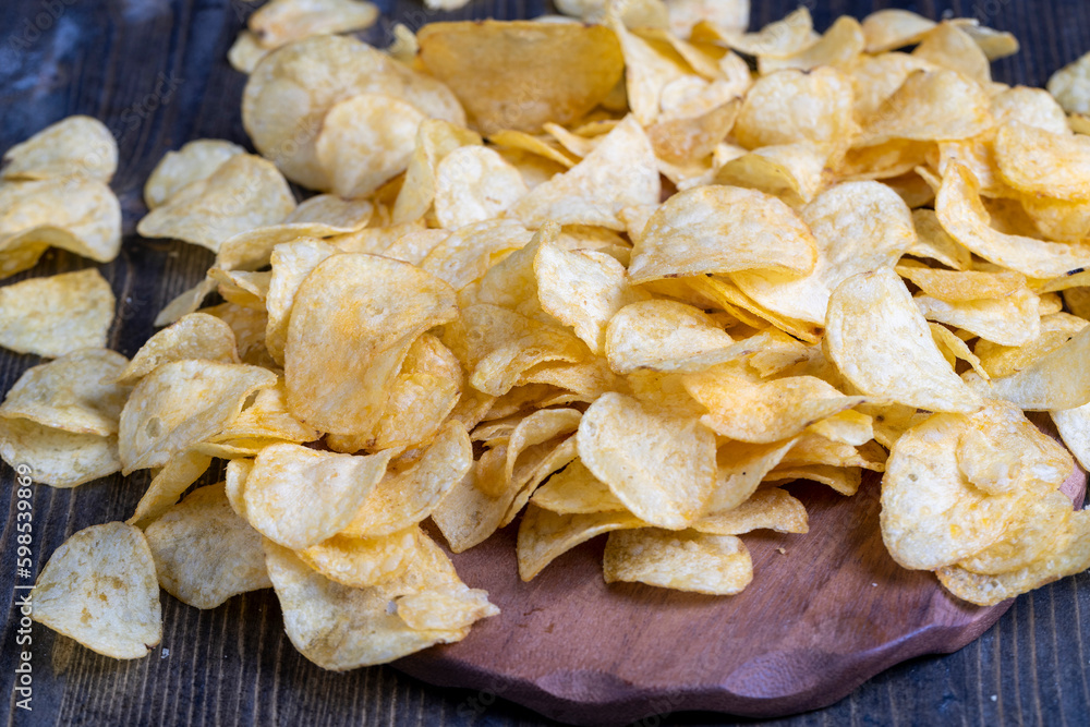 thin potato chips with spices, close up thin potato chips with spices, close up