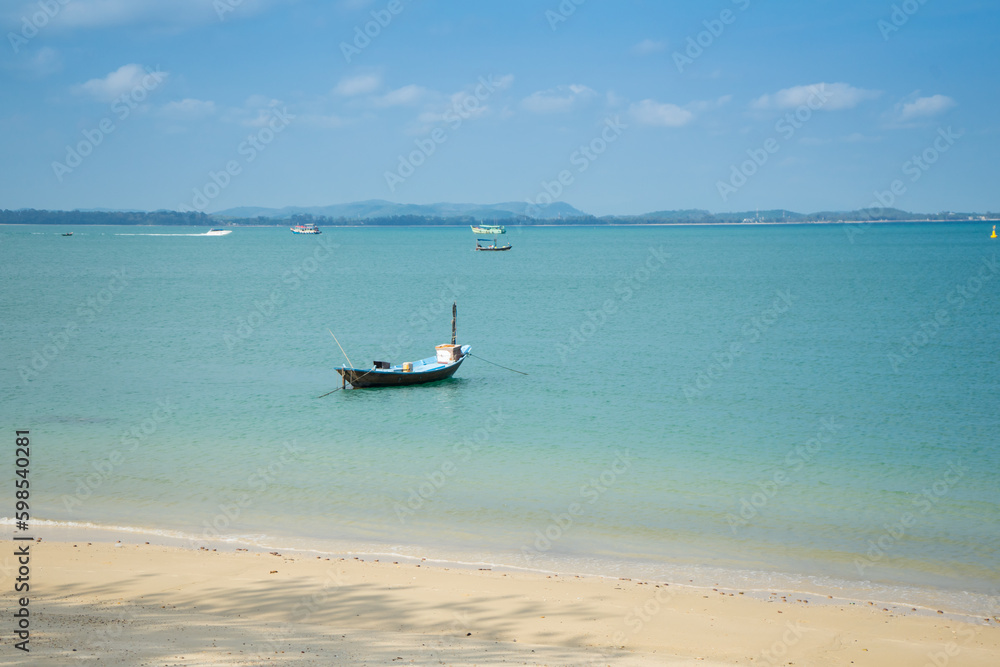 Blue sea water with wooden longtail boat fishing boat on the morning, beautiful sea and island or mountain at Koh Samet Beach in Trat province, Thailand. Blue sea water with wooden longtail boat fishing boat on the morning, beautiful sea and island or mountain at Koh Samet Beach in Trat province, Thailand.