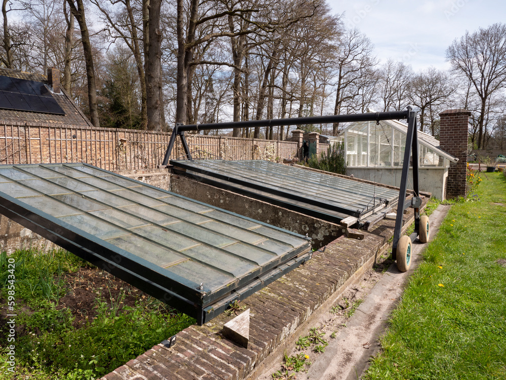 Outdoor Vegetable Greenhouse with fresh growing plants Outdoor Vegetable Greenhouse with fresh growing plants