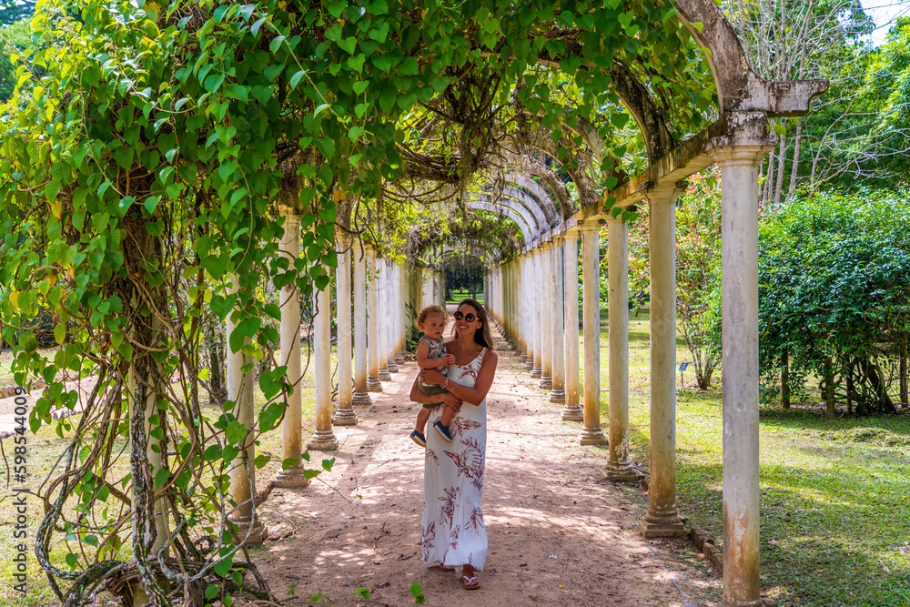 Mother and son walking in Jardim Botanico, Rio de Janeiro Mother and son walking in Jardim Botanico, Rio de Janeiro