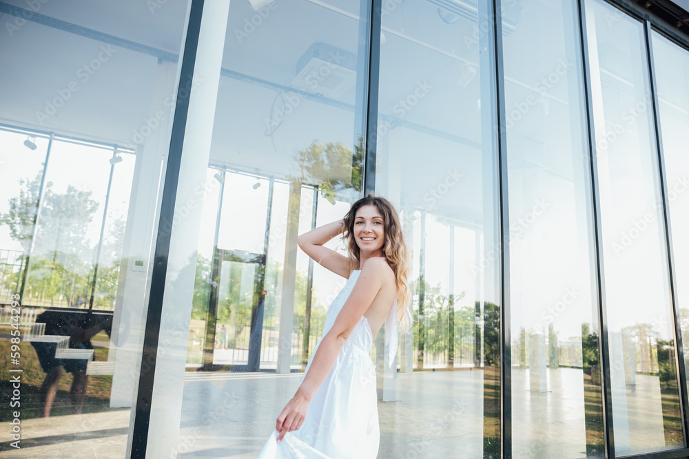 a beautiful woman near glass showcase walk a beautiful woman near glass showcase walk