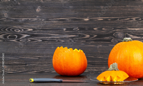 Sweet ripe orange pumpkin is sliced on the table
