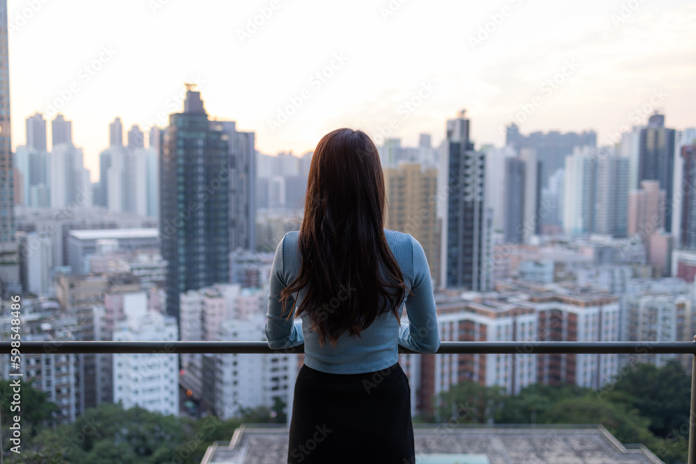 Woman enjoy the city view in Hong Kong Woman enjoy the city view in Hong Kong