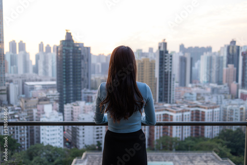 Woman enjoy the city view in Hong Kong