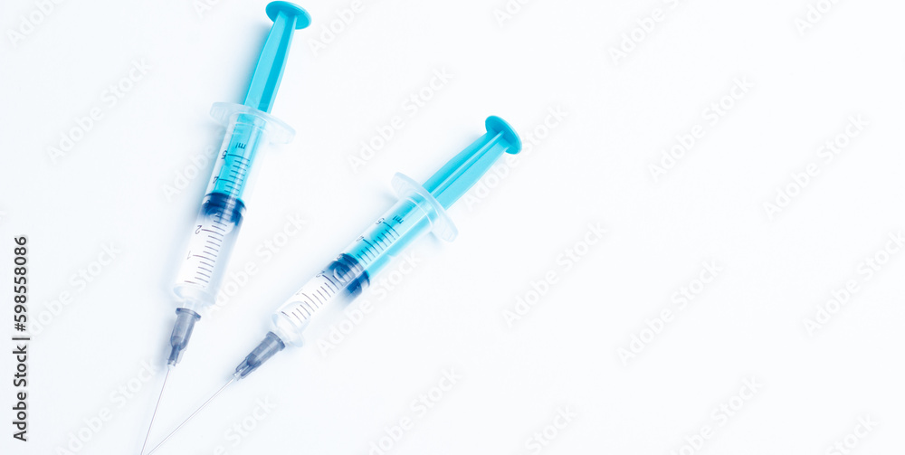 Disposable plastic syringe prepared for injection and vaccination in the hospital. The concept of medicine and health Disposable plastic syringe prepared for injection and vaccination in the hospital. The concept of medicine and health