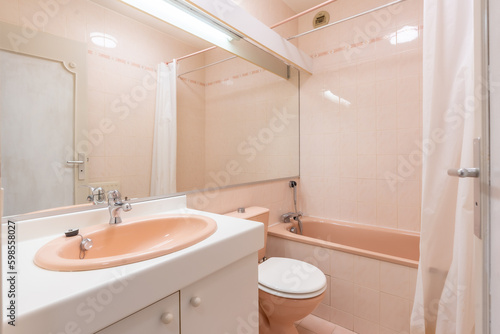 Home bathroom  bright new bathroom interior with tiled glass shower  vanity cabinet  interior designed with white and pink