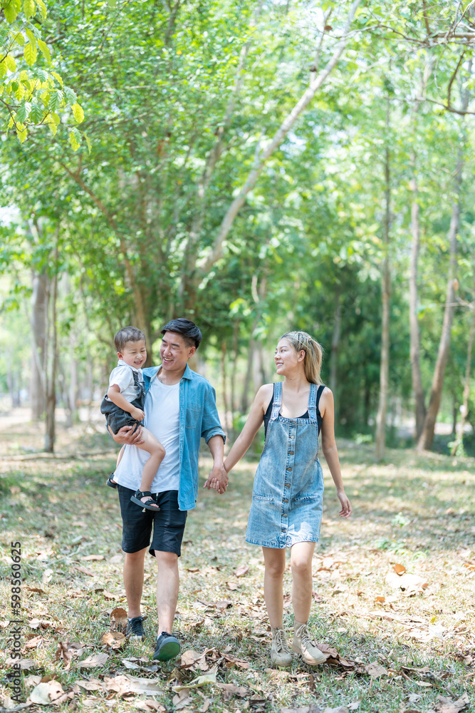 Family enjoying a camping holiday in the countryside ,Camping, travel, tourism, hiking and people. Concept - Happy family with backpacks and thermos at camp.