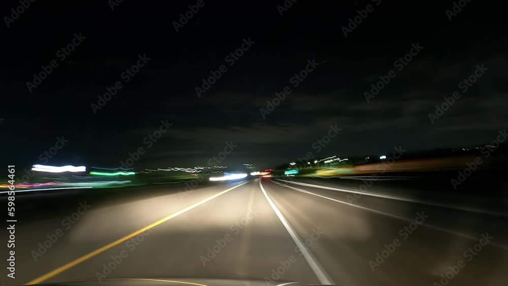 Time lapse while driving on freeway through suburbs or more remote area with less lights. Time lapse while driving on freeway through suburbs or more remote area with less lights.