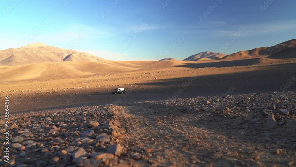 four wheel drive off road vehicle parked in atacama desert four wheel drive off road vehicle parked in atacama desert