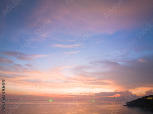 aerial view amazing sky in sunset above the ocean at Karon beach Phuket..Imagine a fantasy bright yellow clouds changing in colorful sky..Gradient color. Sky texture  abstract nature background..