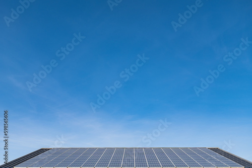 solar panel on top of a roof looking towards the sky