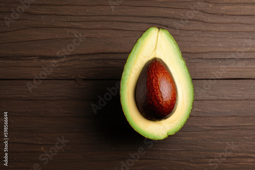 Half of Avocado on a Wooden Background