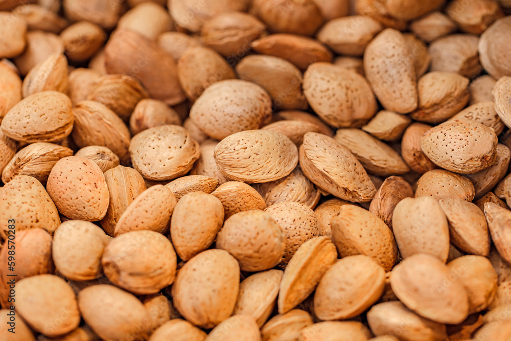 Nuts almonds whole, in bulk, on supermarket, selective focus Nuts almonds whole, in bulk, on supermarket, selective focus