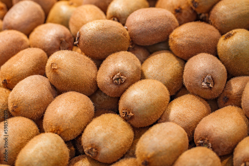 Kiwi fruit brown  whole in bulk  on supermarket  selective focus