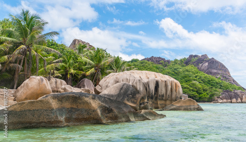 Turquoise water, palm trees and rocks in Anse Source d'Argent
