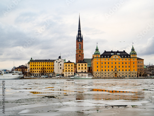 Photography View of the city of Gamla Stan in Stockholm (Sweden) during winter with the froz
