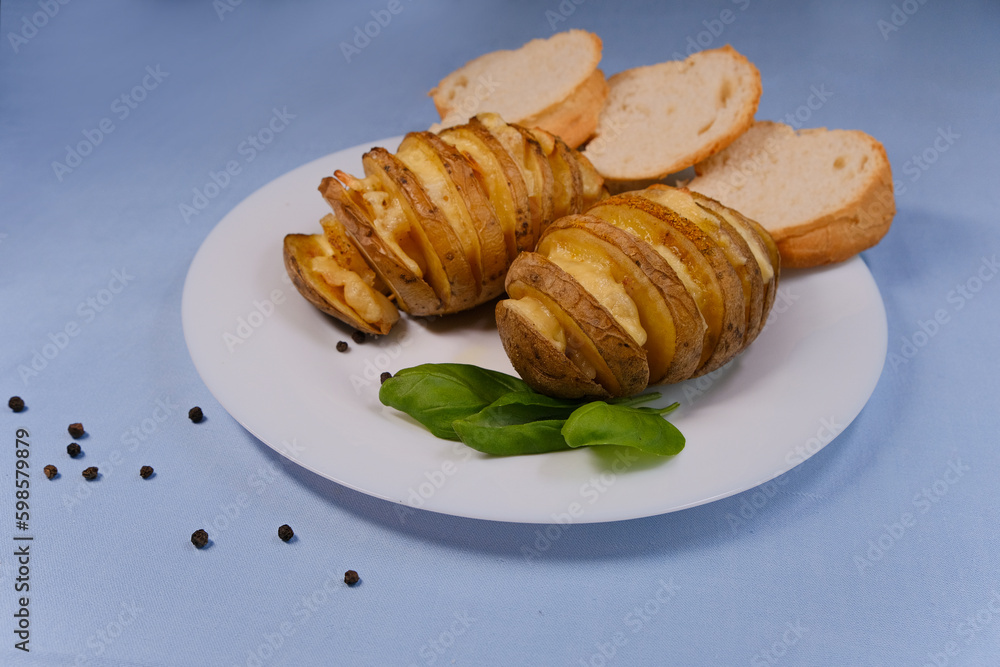 Baked potatoes with lard on a plate Baked potatoes with lard on a plate