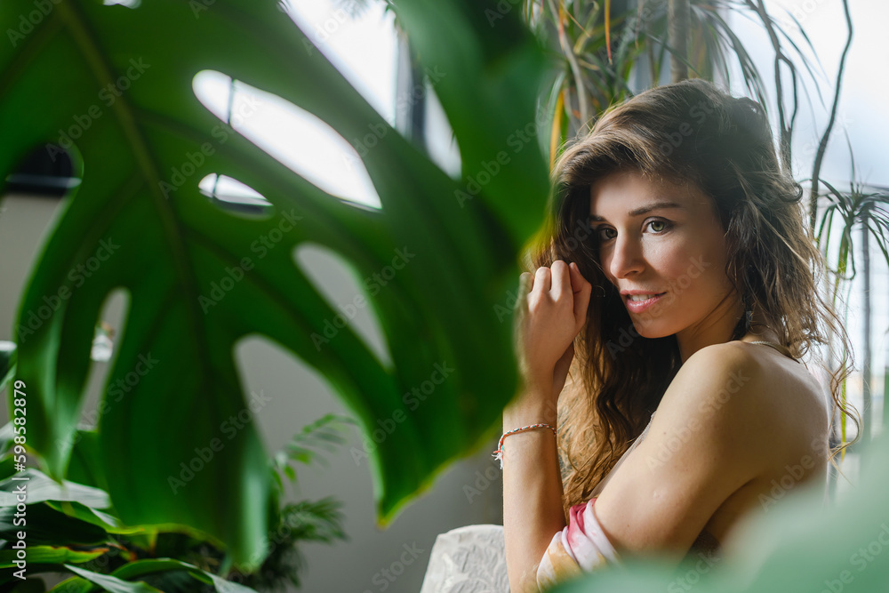 Portrait of cute woman with home plants Portrait of cute woman with home plants