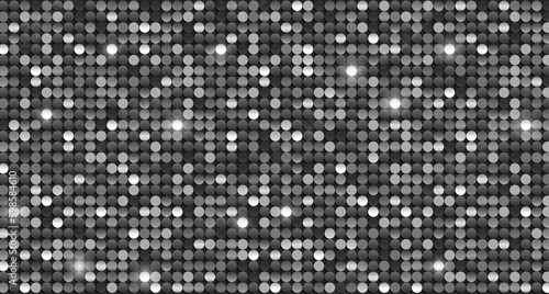 Bright shiny black and white sequins with glitter background