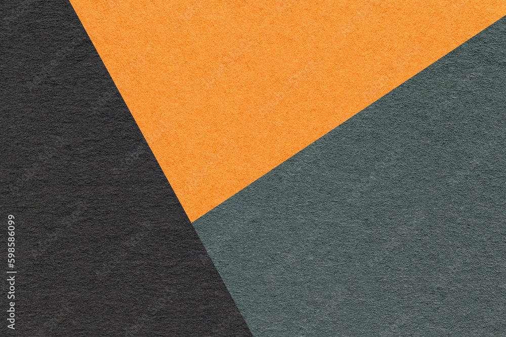 Texture of craft black, green and orange shade color paper background, macro. Vintage abstract cardboard Texture of craft black, green and orange shade color paper background, macro. Vintage abstract cardboard