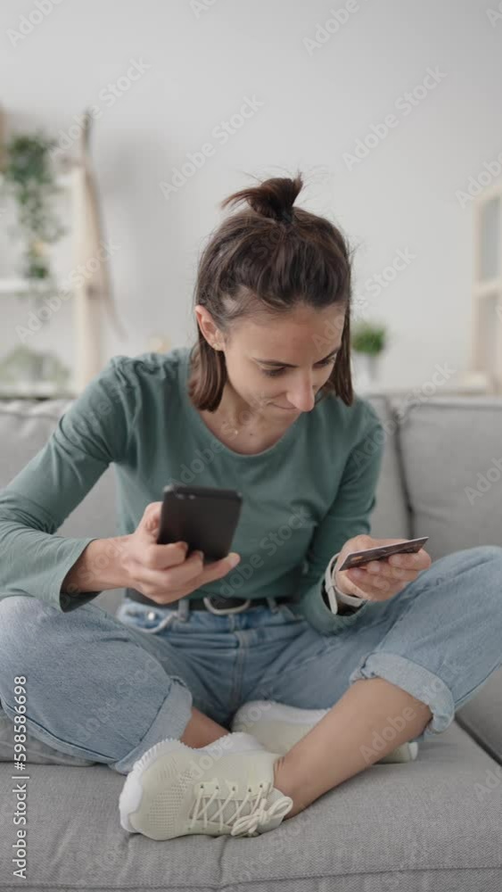 Young hispanic woman buying online on phone and celebrating purchase Young hispanic woman buying online on phone and celebrating purchase