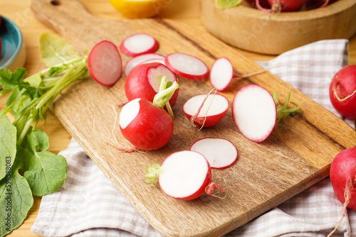Fresh red radish slices on a wooden background. Close-up.
