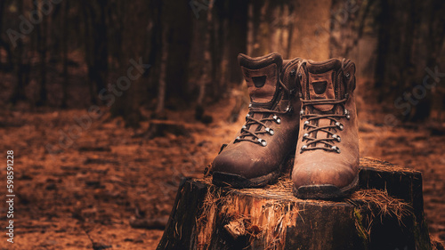Close up of brown leather waterproof hiking boots outdoors in a forest